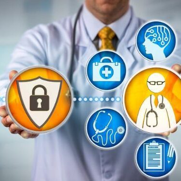 doctor in lab coat holding various cyber medical icons