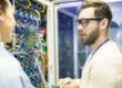 IT professional conducting a cyber audit in a server room